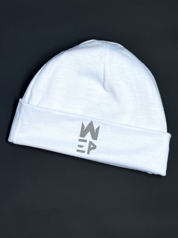 white colored baby hat with EI Patron world logo